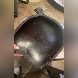 Antique wooden bowl with bird head